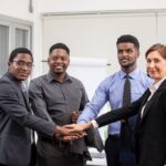 Diverse business team partnering to grow a SaaS reseller business in Africa.